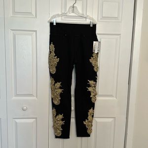 Venus size 12 black jeggings with gold stitching and crystals.
